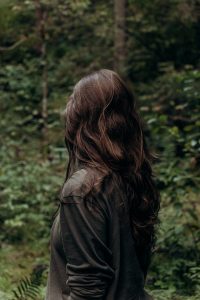 Brunette woman facing away